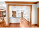 Bright, open kitchen with custom cabinets, marble countertops, and copper-toned wood flooring at 15612 Howell Park Ln, Tampa, FL 33625