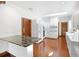 Modern kitchen featuring white cabinets, marble island, and stainless steel appliances at 15612 Howell Park Ln, Tampa, FL 33625
