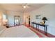 Relaxing main bedroom with wood floors and decoratively styled side tables with lamps at 15612 Howell Park Ln, Tampa, FL 33625