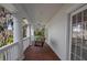 Charming porch with hanging swing and brick flooring at 15612 Howell Park Ln, Tampa, FL 33625