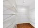A walk-in closet featuring adjustable shelving for efficient storage at 15612 Howell Park Ln, Tampa, FL 33625