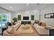 Open-concept living room boasts vaulted ceilings, recessed lighting, and sliding glass doors to the pool area at 16106 Worlington Pl, Odessa, FL 33556