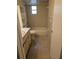 Functional bathroom with a combined tub and shower, neutral tile, and a vanity with storage at 17306 Livingston Ave, Lutz, FL 33559