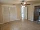 Neutral bedroom with closet and sliding door to patio at 17306 Livingston Ave, Lutz, FL 33559