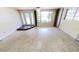 Spacious living room features tons of natural light and unique flooring at 17306 Livingston Ave, Lutz, FL 33559