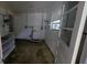 Utility room with shelving and a window at 17306 Livingston Ave, Lutz, FL 33559