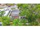 Aerial view of the house shows the yard with brick leading to a patio area at 1737 Prince Philip St, Clearwater, FL 33755