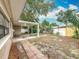Backyard featuring a patio, yard space, and a shed shows an outdoor living at its finest at 1737 Prince Philip St, Clearwater, FL 33755