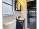 Bathroom with vanity and a doorway to the garage at 1737 Prince Philip St, Clearwater, FL 33755
