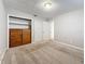 Neutral bedroom with carpet, closet, built-in dresser, and doorway to hall at 1737 Prince Philip St, Clearwater, FL 33755