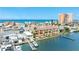 Waterfront condos feature balconies, boat docks, and ocean views on a sunny day at 17817 Gulf Blvd # A, St Petersburg, FL 33708