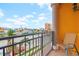 Relaxing balcony with a view of the neighborhood, and chair for sitting and taking in the view at 17817 Gulf Blvd # A, St Petersburg, FL 33708