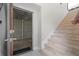 Staircase with access to a basement that features concrete block walls, flooring, and ceiling at 17817 Gulf Blvd # A, St Petersburg, FL 33708