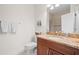 Bathroom featuring granite countertop, vanity, toilet, and shower with tiled walls at 17817 Gulf Blvd # A, St Petersburg, FL 33708