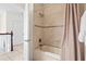 Bathroom with a shower/tub combo behind a light brown shower curtain at 17817 Gulf Blvd # A, St Petersburg, FL 33708