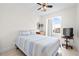 Bedroom featuring a bed, arched window and a view of the neighborhood beyond at 17817 Gulf Blvd # A, St Petersburg, FL 33708