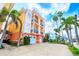 Multi-story townhomes with balconies, attached garages and colorful landscaping near a waterway at 17817 Gulf Blvd # A, St Petersburg, FL 33708