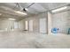 Spacious garage with concrete floor, cinder block walls, and multiple access doors at 17817 Gulf Blvd # A, St Petersburg, FL 33708