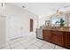 Kitchen with stainless appliances, granite counters, and tiled floor with view to front at 17817 Gulf Blvd # A, St Petersburg, FL 33708