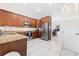 Kitchen with stainless steel appliances, granite counters, and view into the living area at 17817 Gulf Blvd # A, St Petersburg, FL 33708