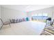 Bright lanai with tile floor offers water views with sliding glass doors at 17817 Gulf Blvd # A, St Petersburg, FL 33708