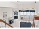 Spacious living room featuring a fireplace and water views from the balcony at 17817 Gulf Blvd # A, St Petersburg, FL 33708