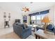Bright living room features waterfront views, cozy fireplace, ceiling fan, and comfortable seating for relaxation and entertainment at 17817 Gulf Blvd # A, St Petersburg, FL 33708
