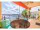 A relaxing waterfront patio features outdoor seating and stunning views of the water and boats at 17817 Gulf Blvd # A, St Petersburg, FL 33708