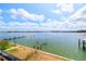 A serene view of the water with dock from the building's water access at 17817 Gulf Blvd # A, St Petersburg, FL 33708