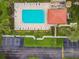 Aerial view showcasing a beautiful pool, lounge chairs, and well-maintained landscaping in the community at 1801 E Lake Rd # 20 G, Palm Harbor, FL 34685