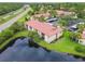 Aerial view of buildings near a pond and highway at 1801 E Lake Rd # 20 G, Palm Harbor, FL 34685