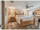 Inviting bedroom features a wooden bed frame, ceiling fan, and neutral decor for a relaxing atmosphere at 1801 E Lake Rd # 20 G, Palm Harbor, FL 34685