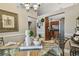 Well-appointed dining area with a glass-top table next to the kitchen and beige wall colors at 1801 E Lake Rd # 20 G, Palm Harbor, FL 34685