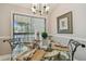 Dining room featuring a glass table and large window providing plenty of natural light and an outdoor view at 1801 E Lake Rd # 20 G, Palm Harbor, FL 34685