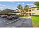 Residential condo building with covered parking, lush landscaping and convenient access at 1801 E Lake Rd # 20 G, Palm Harbor, FL 34685