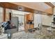 Granite kitchen countertop overlooking the kitchen and dining area, stainless steel appliances, and wooden cabinetry at 1801 E Lake Rd # 20 G, Palm Harbor, FL 34685