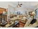 Cozy living area with bar seating connecting to the kitchen and dining space with comfortable sofas at 1801 E Lake Rd # 20 G, Palm Harbor, FL 34685
