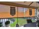 Outdoor patio with seating area overlooking a pond and manicured lawns, offering a serene view at 1801 E Lake Rd # 20 G, Palm Harbor, FL 34685