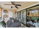 Enclosed patio with cozy seating, ceiling fan, and natural light creating a relaxing atmosphere at 1801 E Lake Rd # 20 G, Palm Harbor, FL 34685