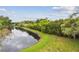 Community pond with lush green surroundings, creating a peaceful and scenic environment at 1801 E Lake Rd # 20 G, Palm Harbor, FL 34685