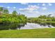 Scenic pond with lush greenery, creating a tranquil and picturesque setting in the community at 1801 E Lake Rd # 20 G, Palm Harbor, FL 34685
