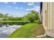 Beautiful pond view showcasing lush landscaping and serene water reflections near the property at 1801 E Lake Rd # 20 G, Palm Harbor, FL 34685