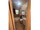 Compact bathroom featuring a shower-tub combination and a small white vanity at 18133 Us Highway 41, Spring Hill, FL 34610