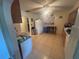 Spacious kitchen with tile flooring, white appliances, and a breakfast bar beneath the window at 18133 Us Highway 41, Spring Hill, FL 34610
