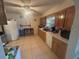 Spacious kitchen with tile flooring, white appliances, and wood cabinetry at 18133 Us Highway 41, Spring Hill, FL 34610