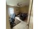 Cozy living room has tile floors and two leather recliners with a ceiling fan at 18133 Us Highway 41, Spring Hill, FL 34610