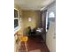 Home office at entrance features a desk, office chair, and window offering natural light at 18133 Us Highway 41, Spring Hill, FL 34610