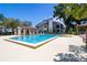 Sparkling community pool with a cabana and ample seating to enjoy the outdoors at 1854 Lake Cypress Dr # 1854, Safety Harbor, FL 34695