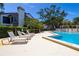 Enjoy the community pool with lounge chairs and shallow end at 1854 Lake Cypress Dr # 1854, Safety Harbor, FL 34695