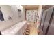 Bathroom features a double vanity with marble countertop and fun sloth-themed shower curtain at 20023 Pergola Bend Ln, Tampa, FL 33647